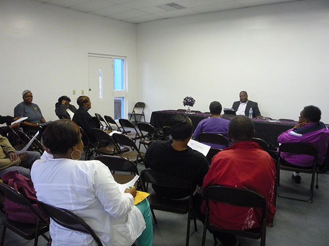 Reverend Clinton J. Hall II and church members